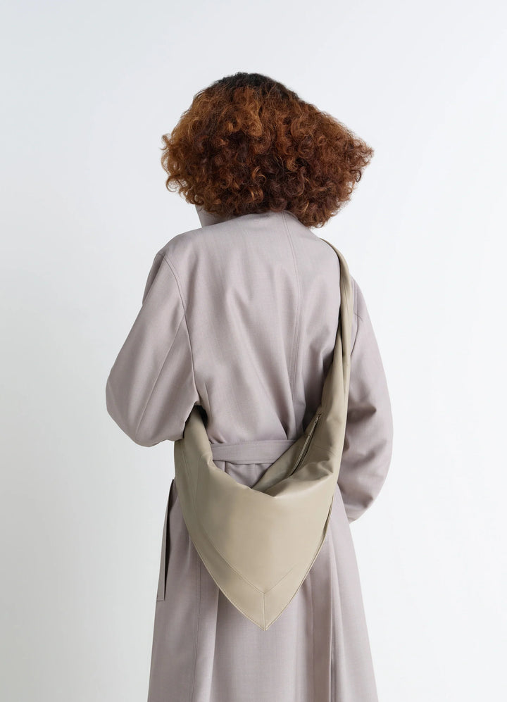 Lemaire Small Scarf Extended Handle in Nappa Leather, model shot, Back view Twisted strap detail