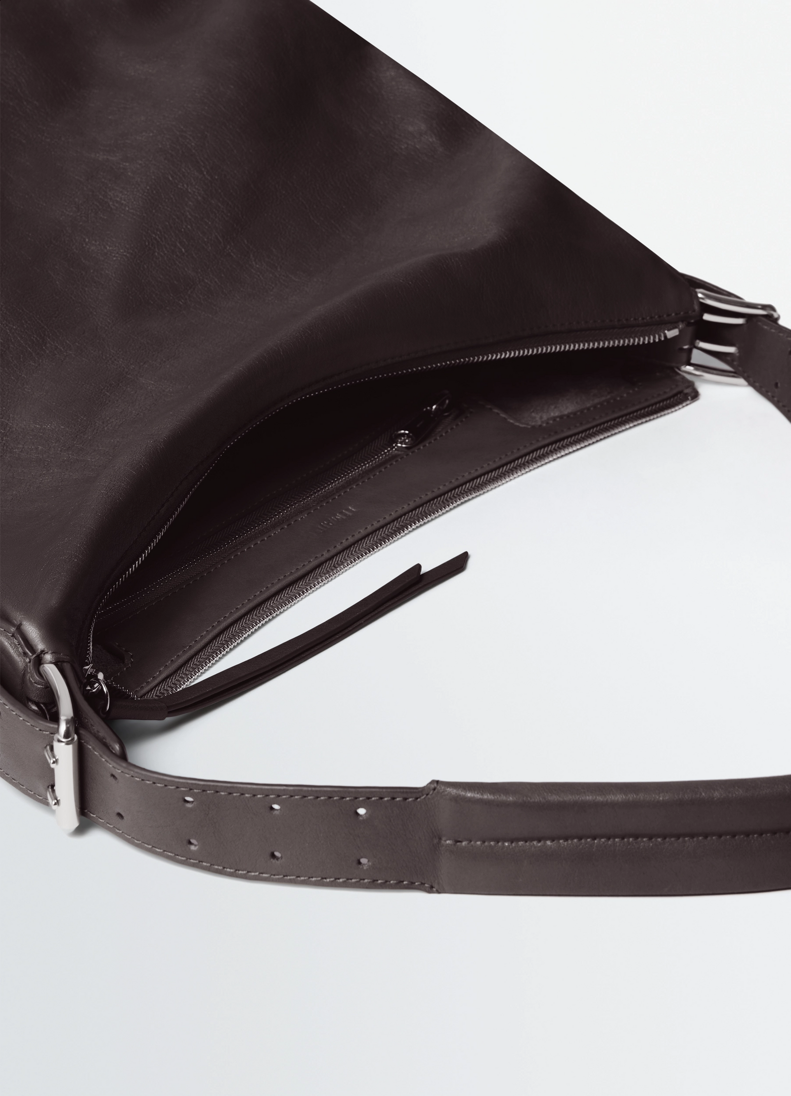 Belted hobo bag in glazed paper leather, product shot, top zipper view open interior detail