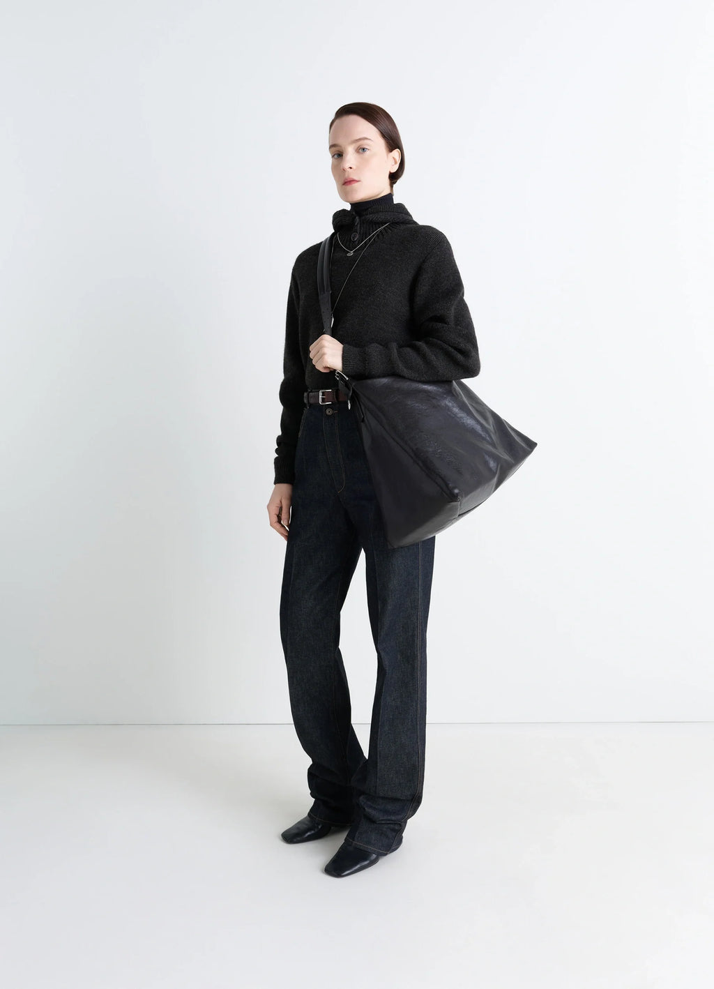 Belted Hobo Bag in Glazed Paper Leather, model shot, three-quarter view shoulder carry style