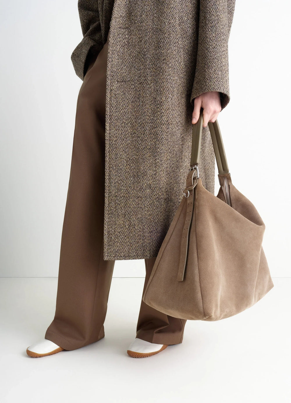 Belted Hobo Bag in Warm Textured Suede, model shot, handheld perspective softly structured design