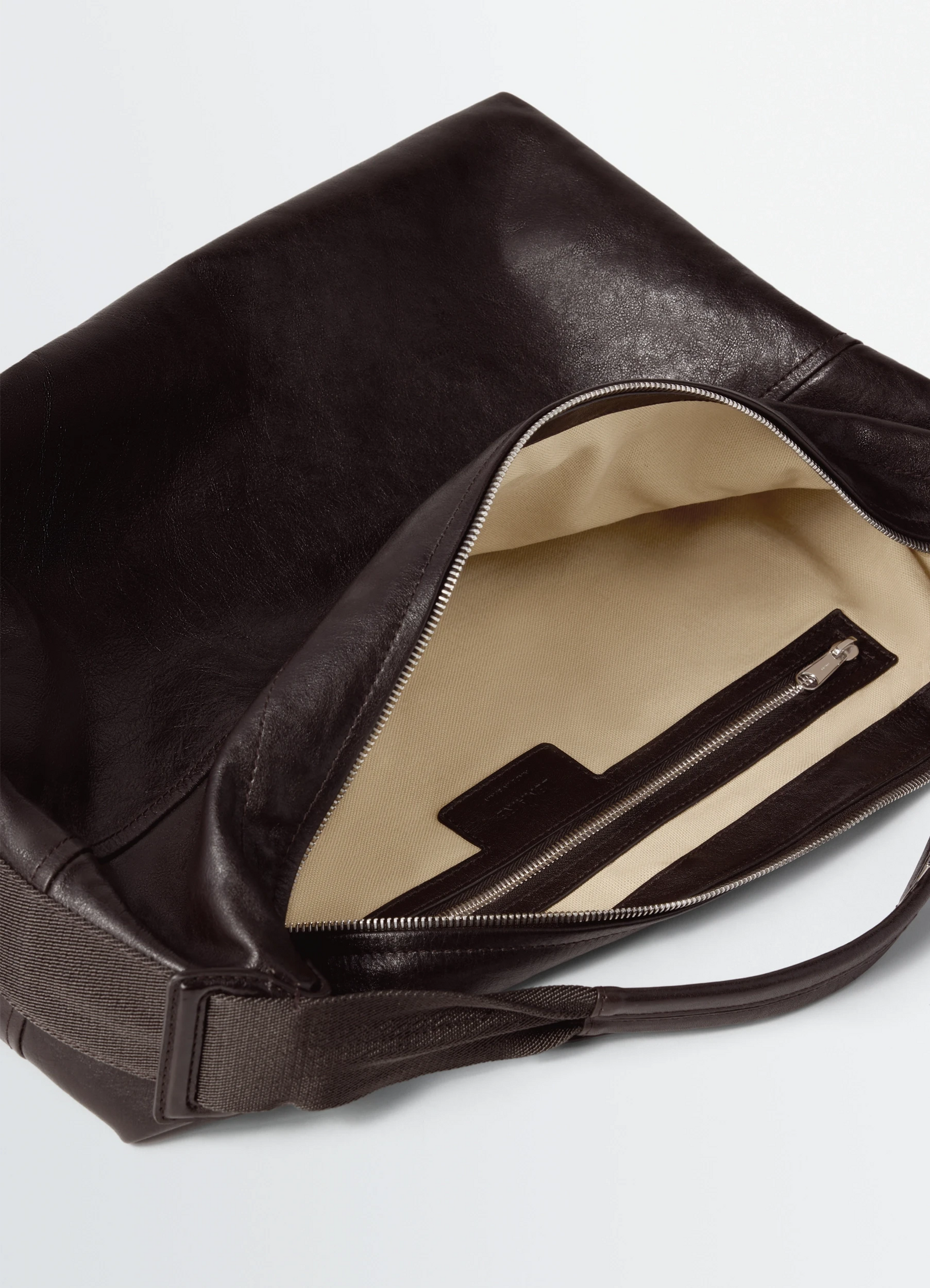 Berlingot hobo bag in leather in glazed paper, product shot, top view open zipper interior