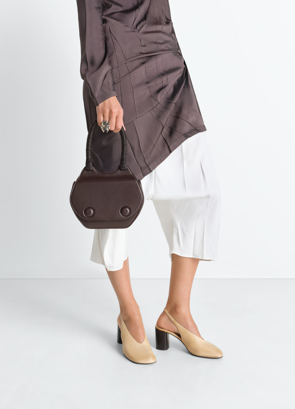 Frog Handbag in Leather in Shiny Calfskin Leather, model shot, worn by model rounded handle