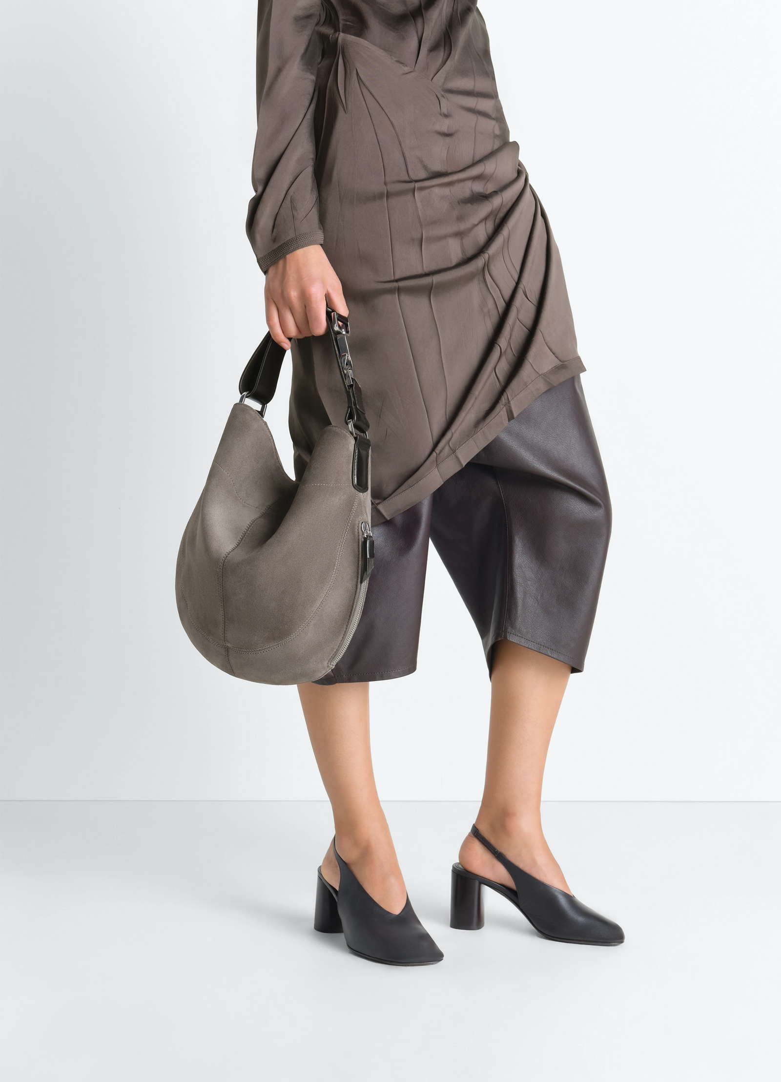 Hobo quiver clip bag in suede leather, model shot, side view drape effect