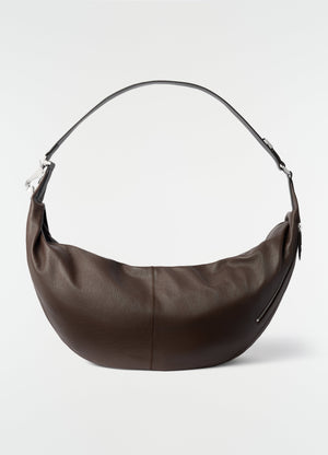 Large brown leather quiver clip bag by lemaire with silver hardware on plain white background
