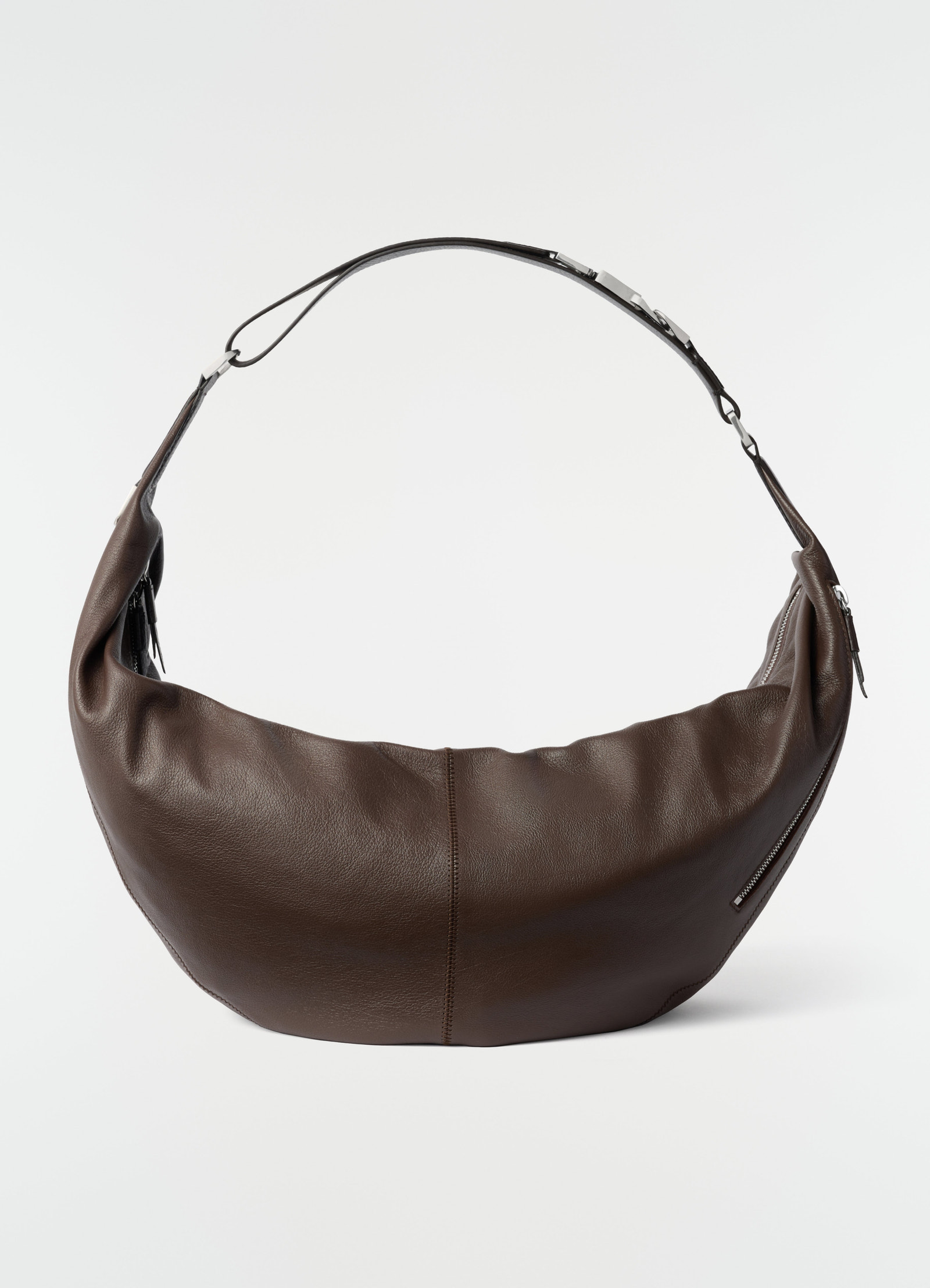 Large brown leather quiver clip bag with silver hardware by lemaire on plain white background