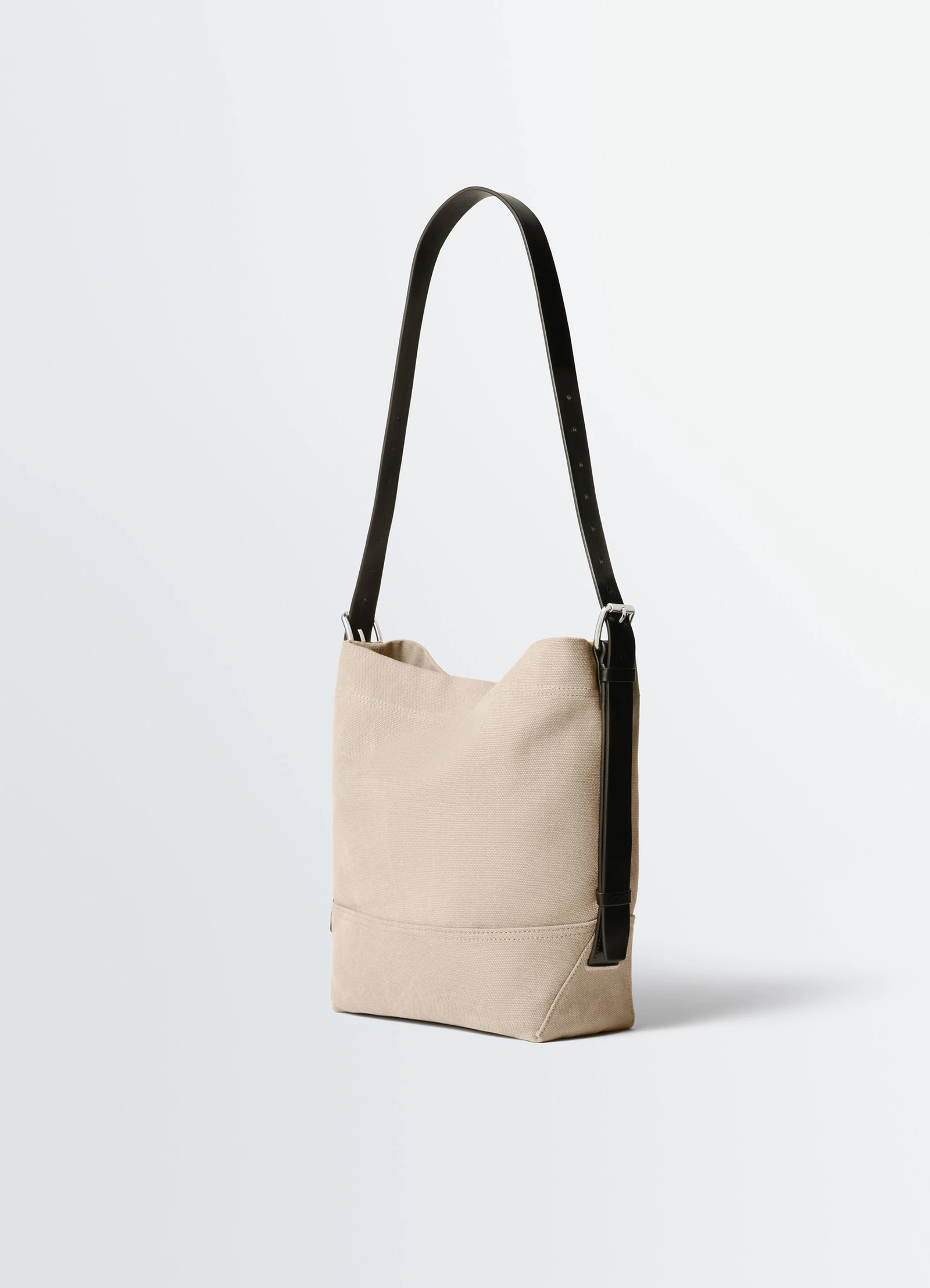 Small belted tote bag in tie-dye cotton canvas, product shot, back angled view structured silhouette