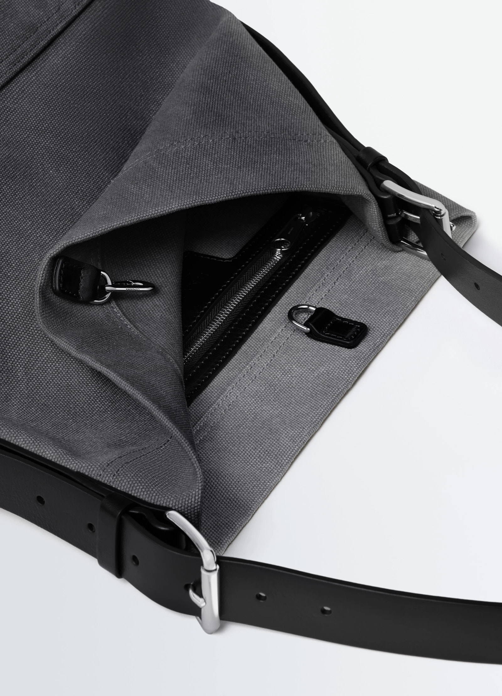 Small belted tote bag in tie-dye cotton canvas, product shot, interior detail view open zipper compartment