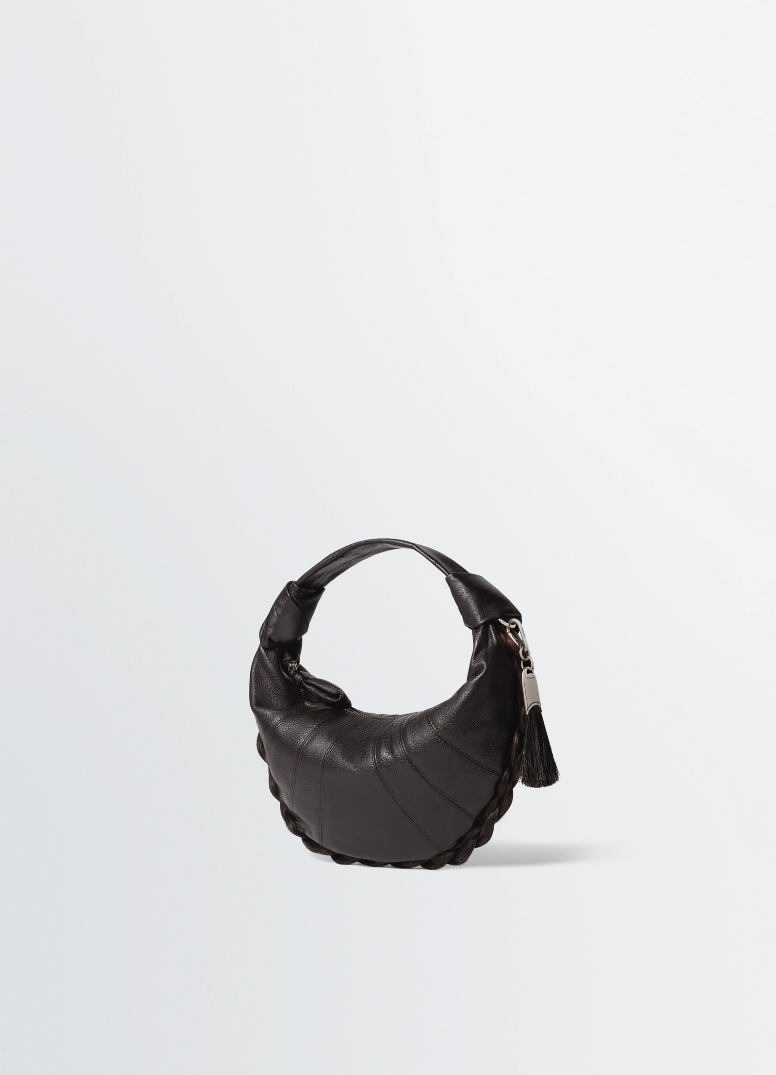 Mini fortune croissant bag in leather and horsehair, product shot, three-quarter view curved silhouette