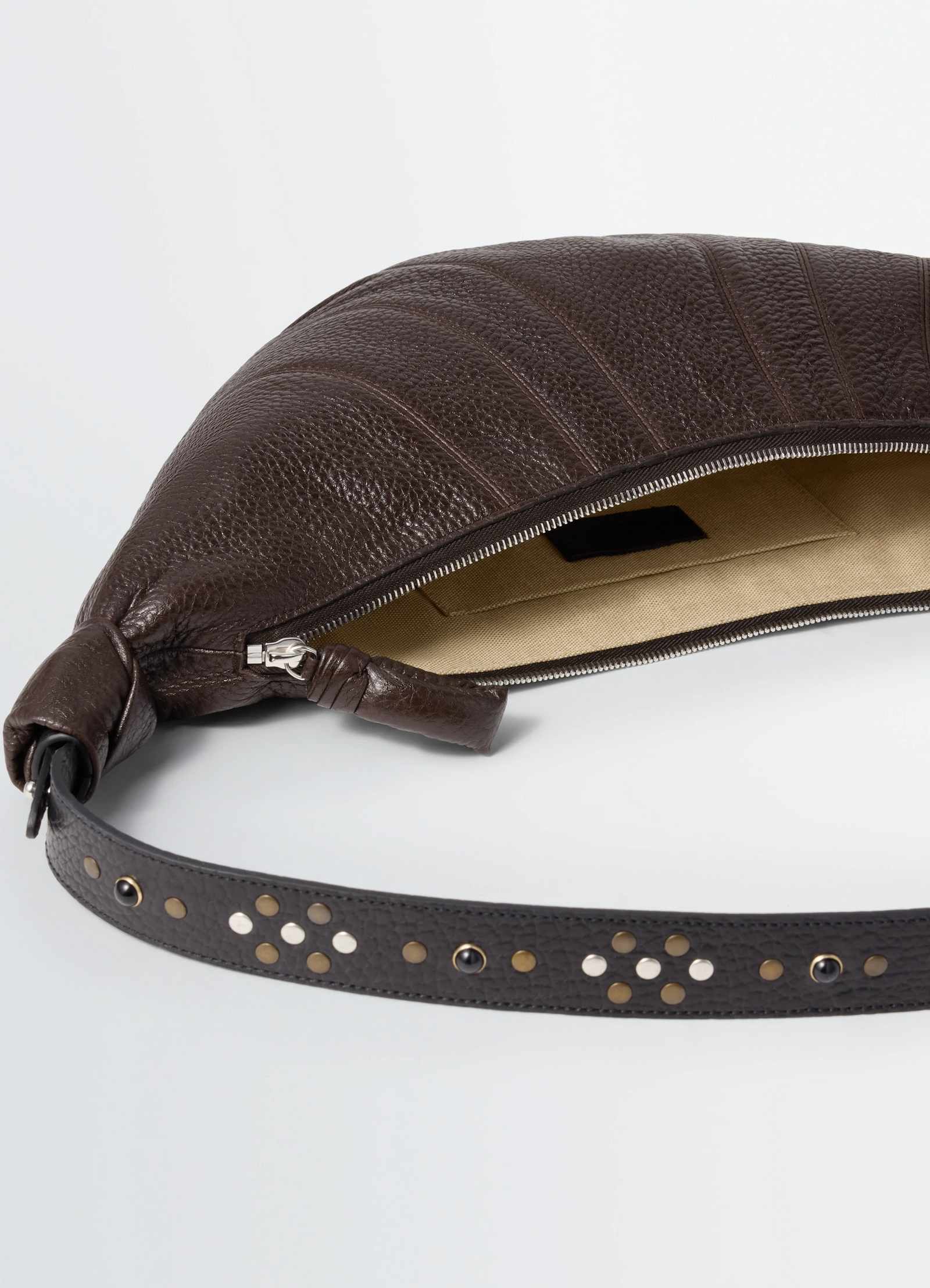 Western studs medium croissant bag in grained leather, product shot, top detail view interior view with zipper