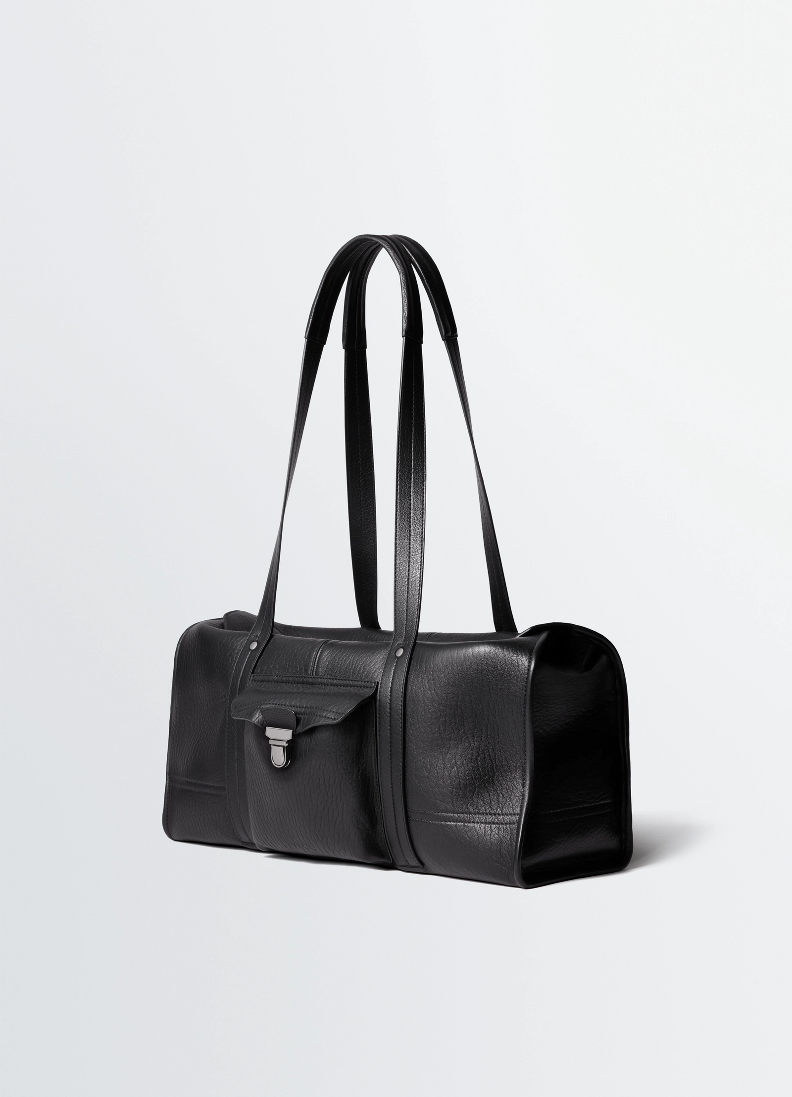 Lemaire soft gear tote bag in black bubble leather, product shot, three-quarter view long handles, flap detail
