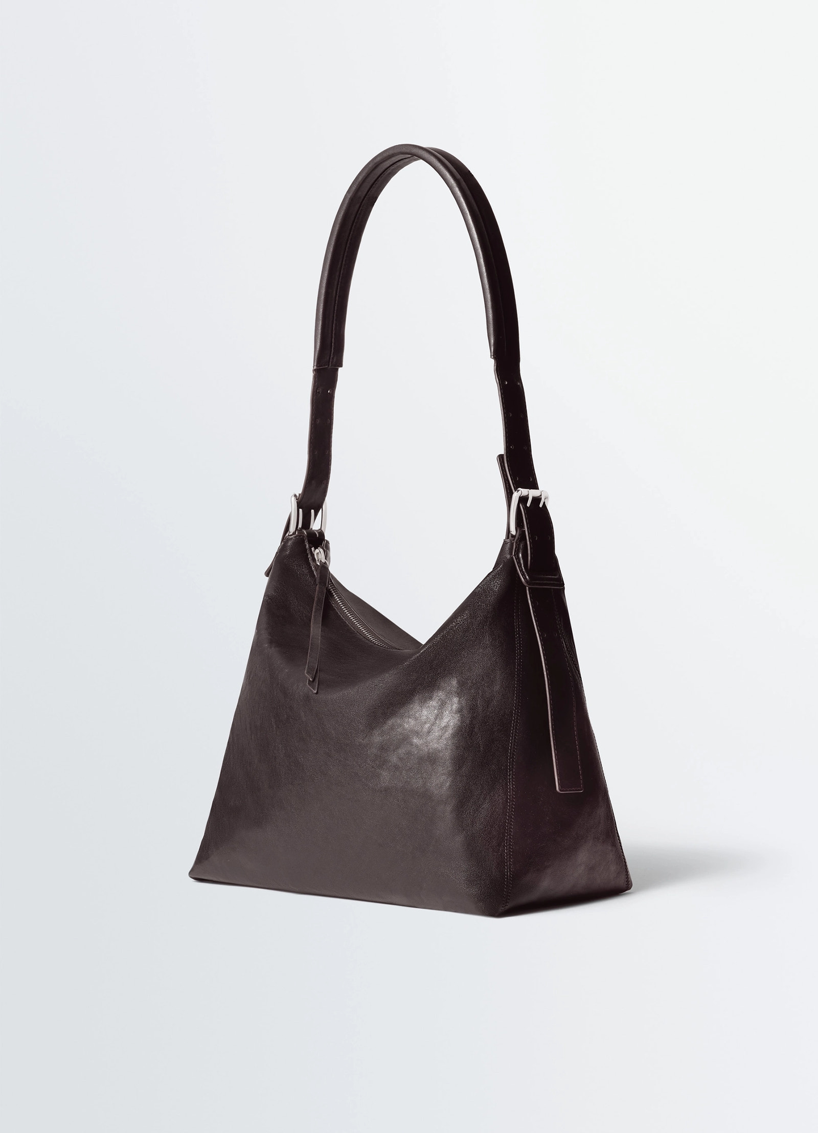 Small belted hobo bag in leather, product shot, angled view buckle strap detail