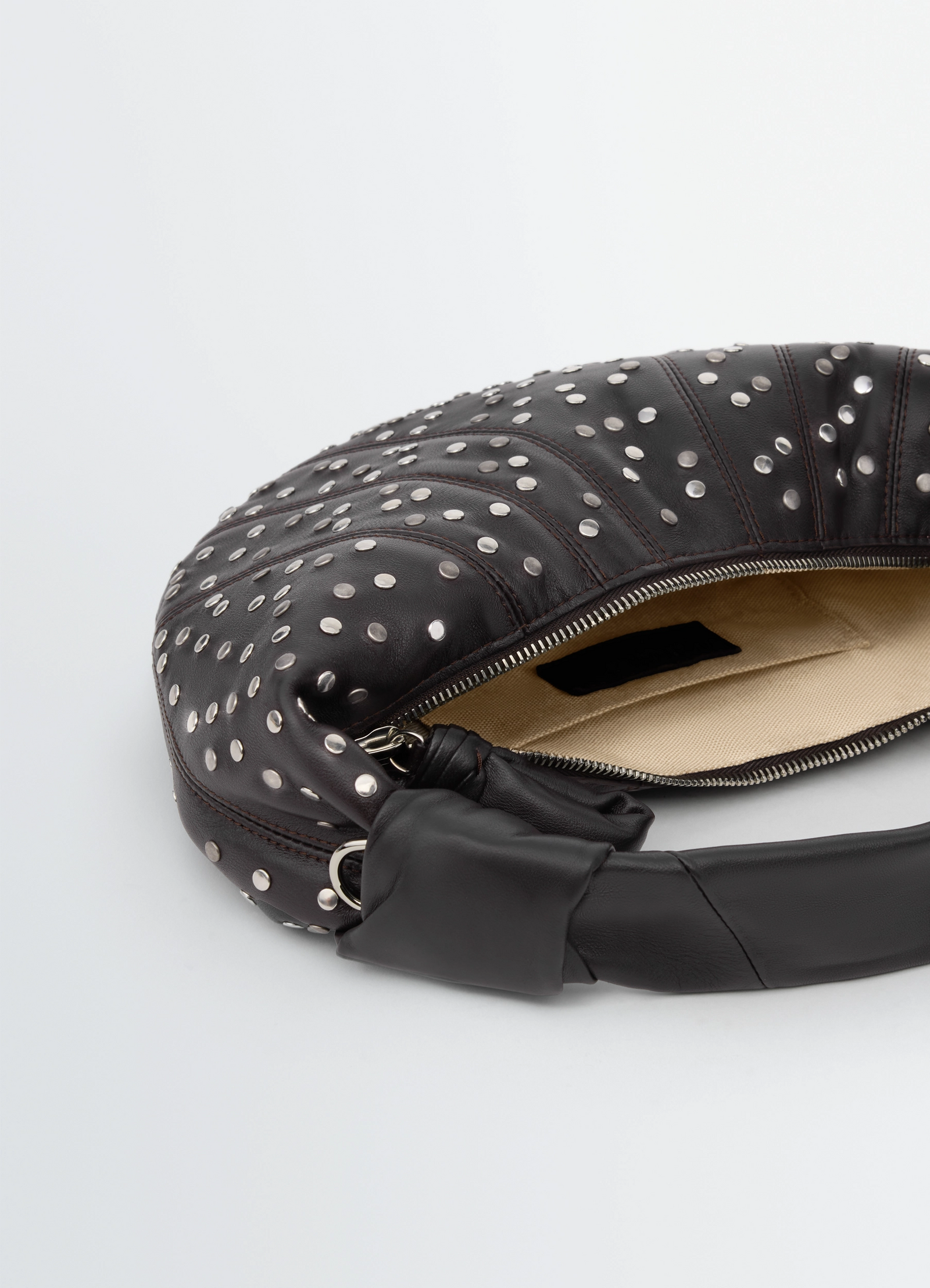 Studs dots mini fortune croissant b in leather, product shot, top detail view zippered opening detail