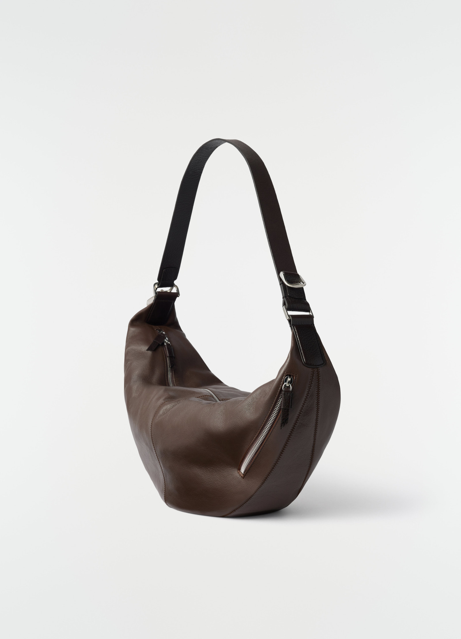 Quiver clip bag in dark brown leather with black strap by lemaire side view on white background