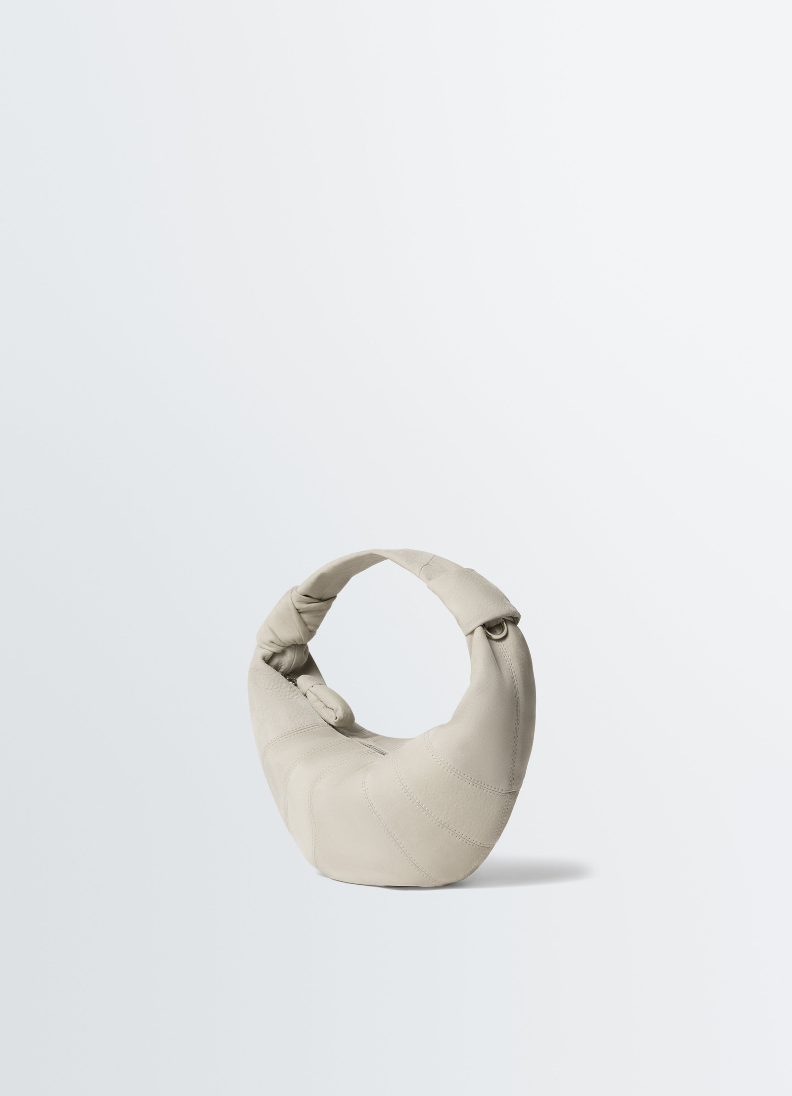 Mini fortune croissant bag in beige alpaca nubuck leather with knotted handle detail on white background lemaire