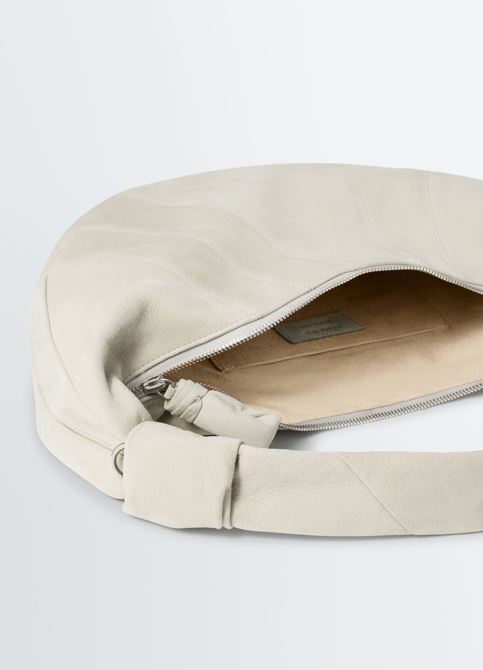Fortune croissant beige alpaca nubuck bag by lemaire with zipper open interior close-up detail