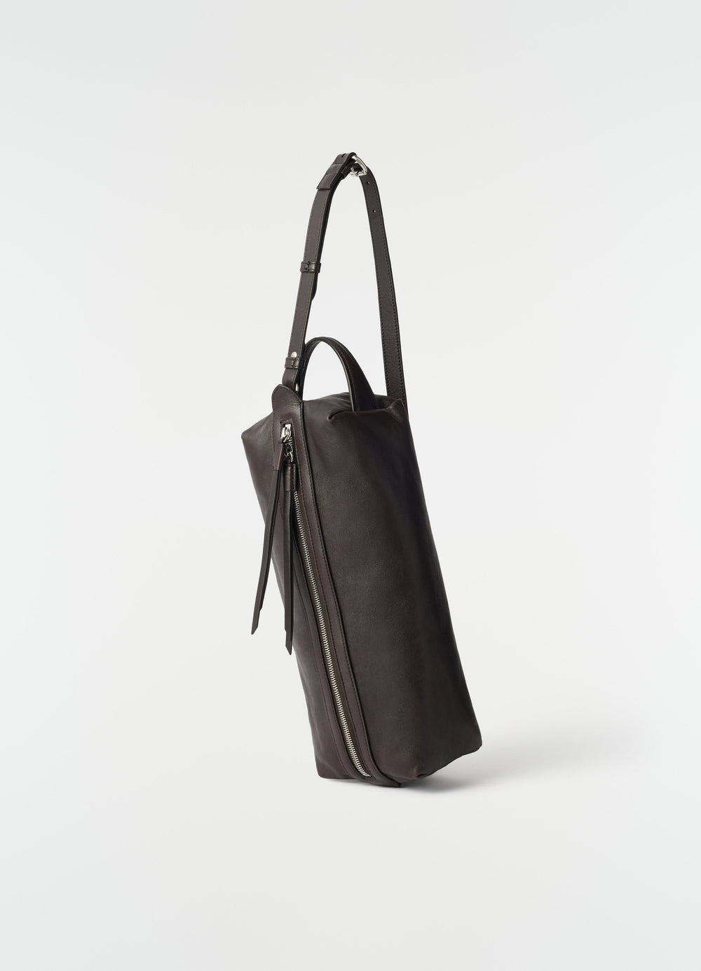 Care shoulder bag in dark brown nappa lambskin with silver zip detail by LEMAIRE side view on white background