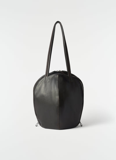 Hobo helmet bag in black grained leather by LEMAIRE front view on plain white background
