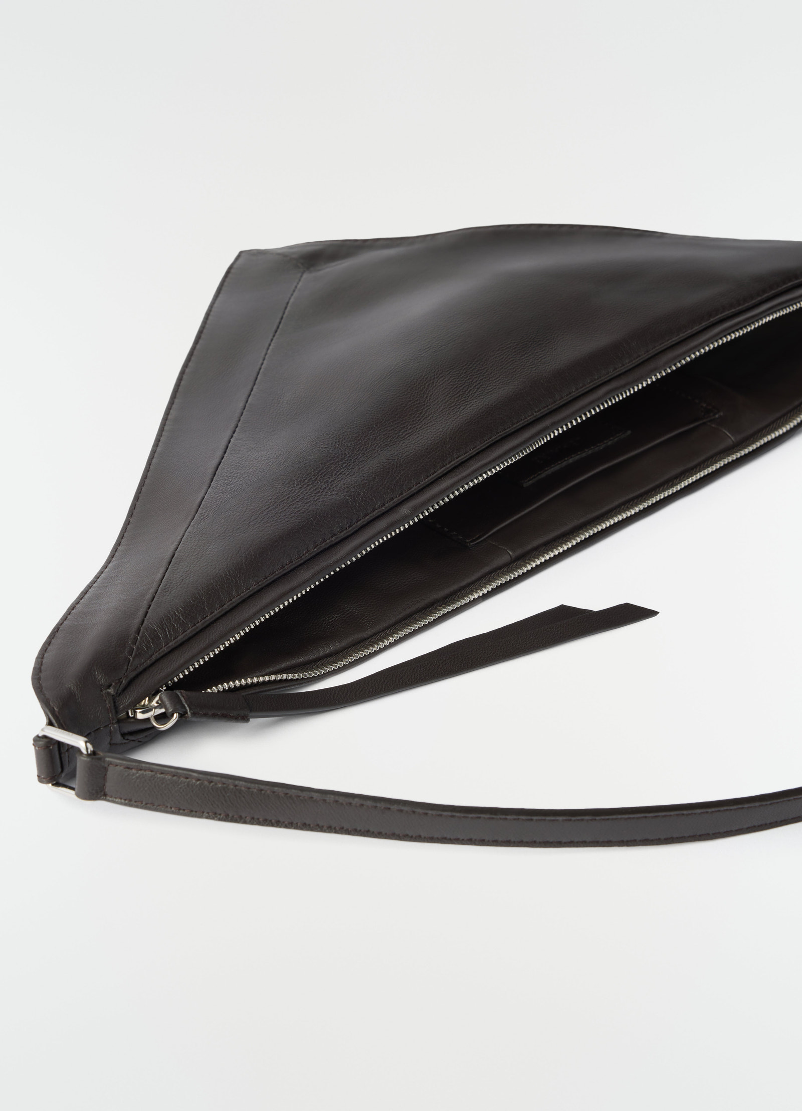 Pocket scarf bag in shiny black nappa lambskin leather by lemaire open with visible zipper detail on white background