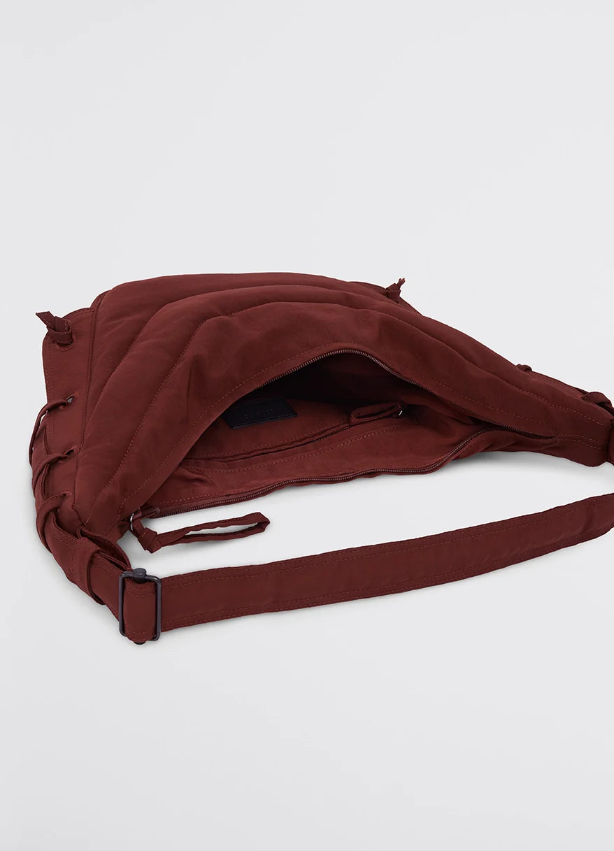 Small soft game bag in fluffy-nylon canvas, product shot, top open view quilted texture visible