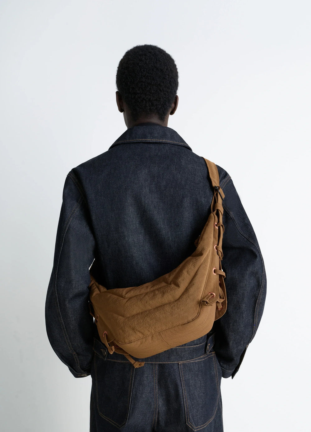 Small Soft Game Bag in Quilted Water-Repellent Nylon, model shot, Back view Embroidered eyelets