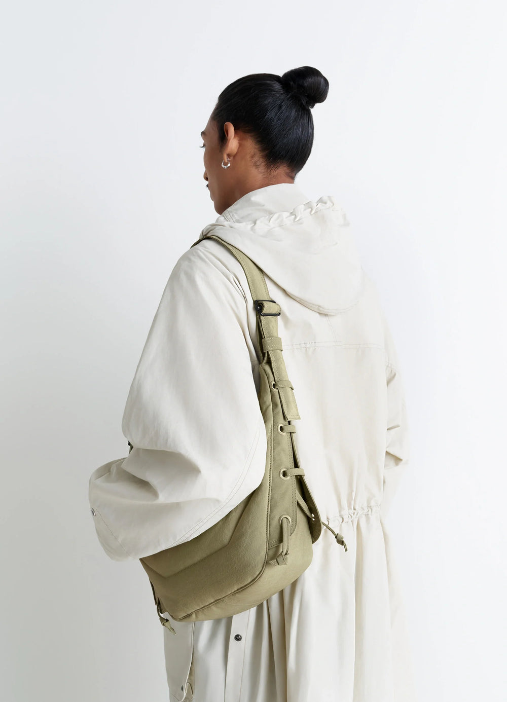 Small Soft Game Bag in Quilted Water-Repellent Nylon, model shot, Back view Embroidered eyelets, matching laces