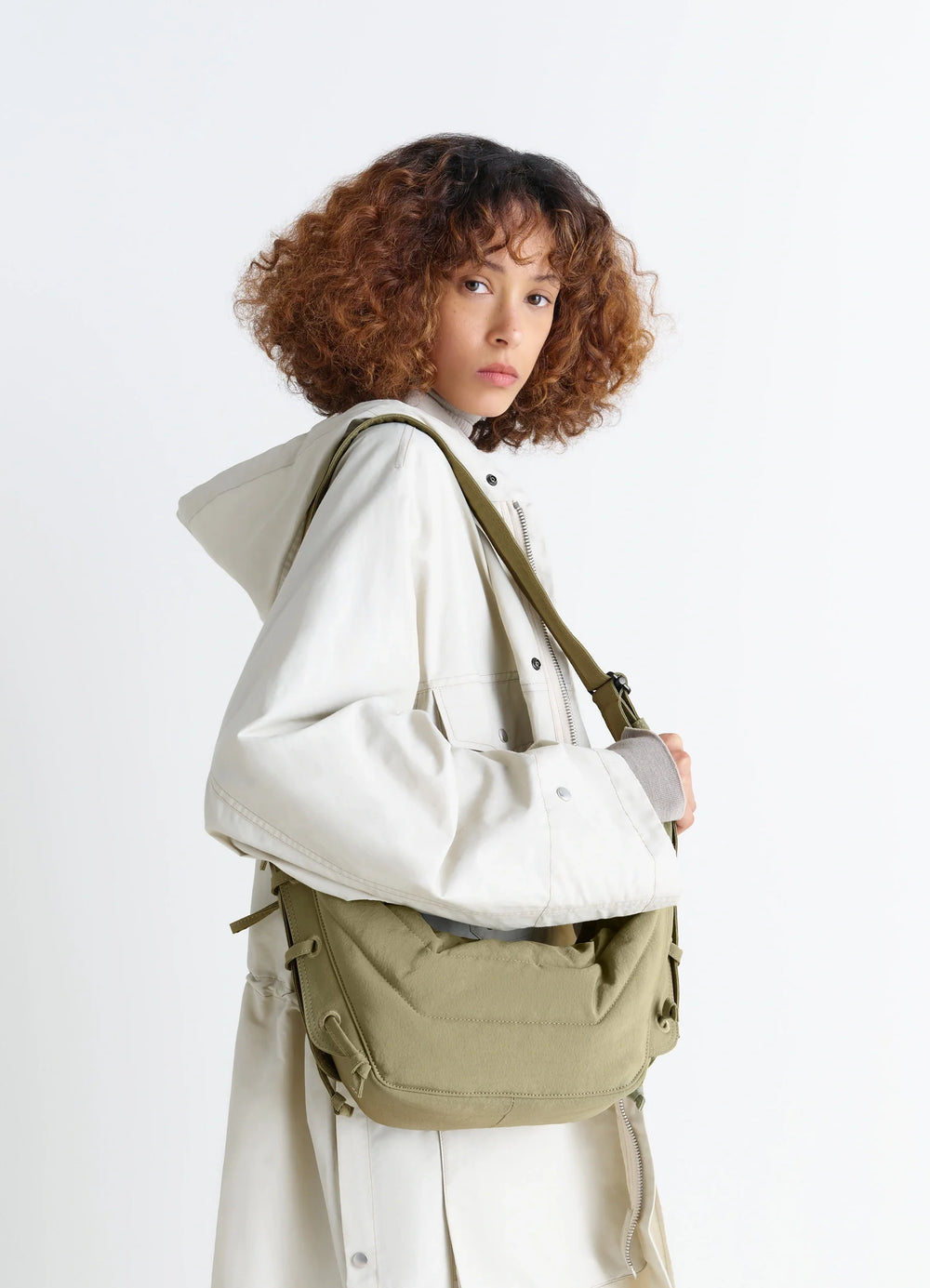 Small Soft Game Bag in Quilted Water-Repellent Nylon, model shot, side view shoulder strap detail