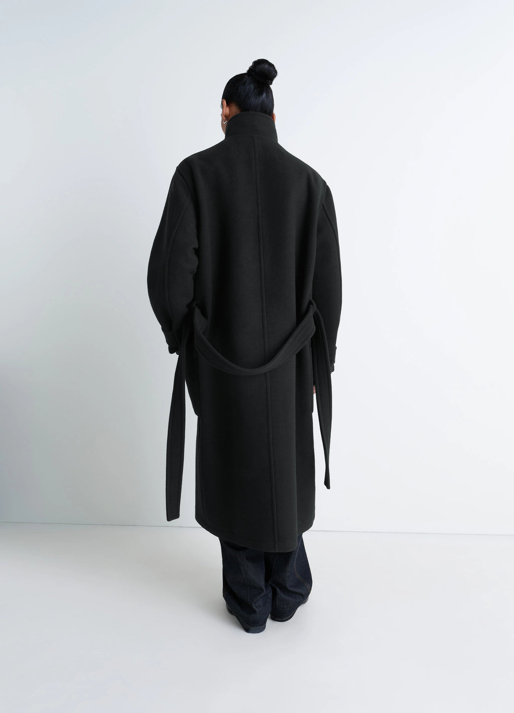 Lemaire Wrap Coat in Black Double-Faced Wool, model shot, back view belted back fit