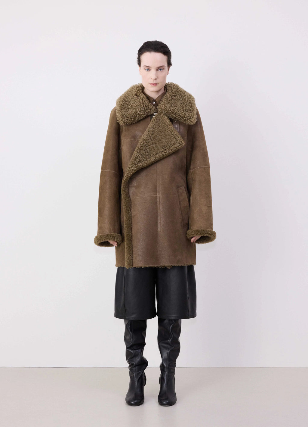 Lemaire Asymmetrical Shearling Coat in Curly Lamb Shearling, Grained Leath, model shot, Front view Boxy oversize fit
