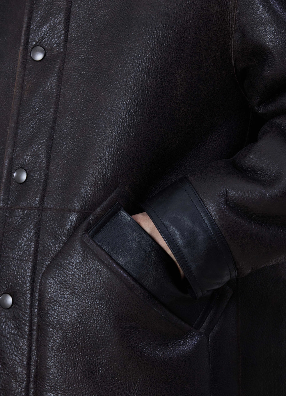 Lemaire Shearling Coat in Heavy Lamb Shearling, side detail shot buttoned pocket accent