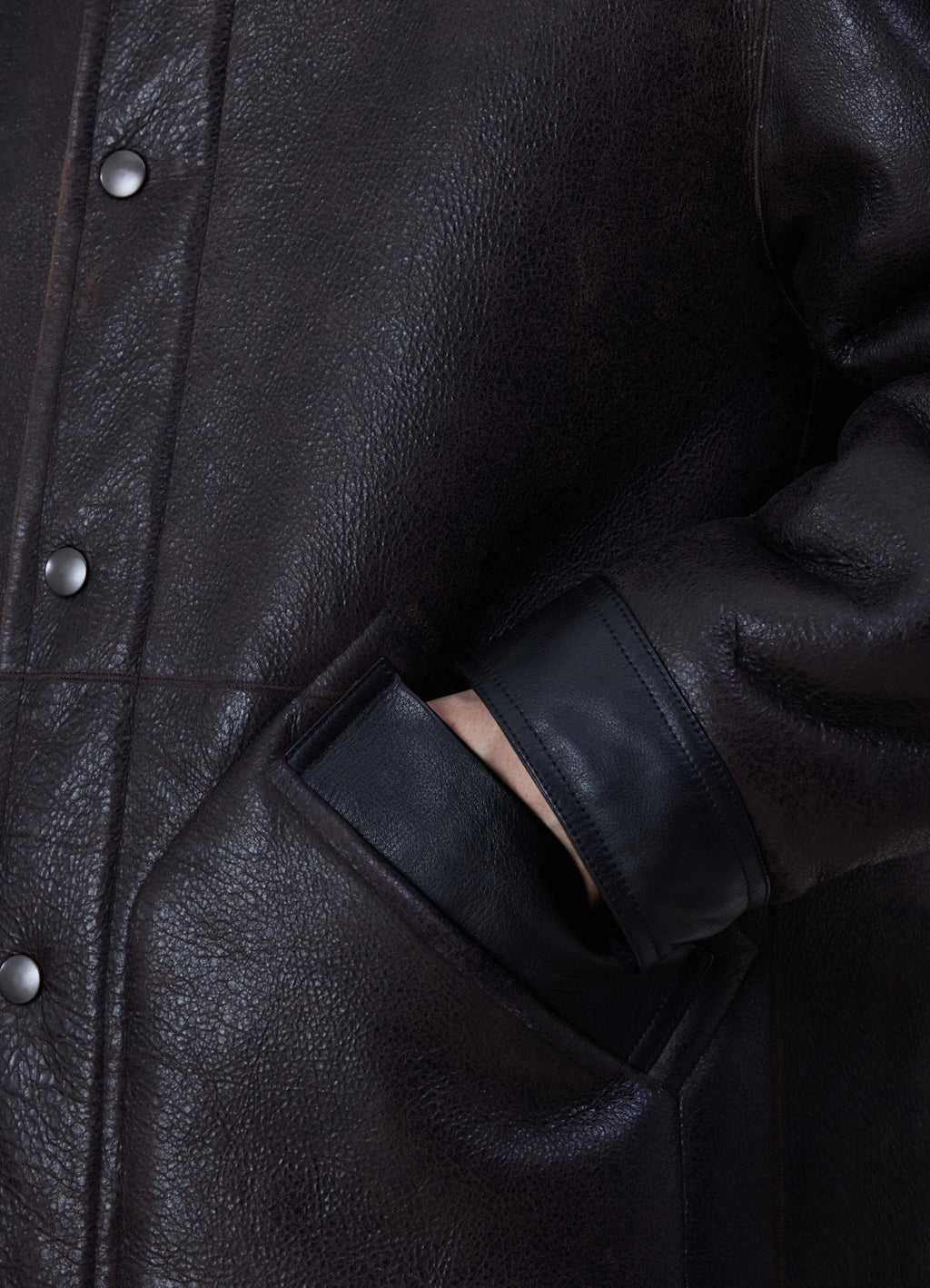 Lemaire Shearling Coat in Heavy Lamb Shearling, side detail shot buttoned pocket accent