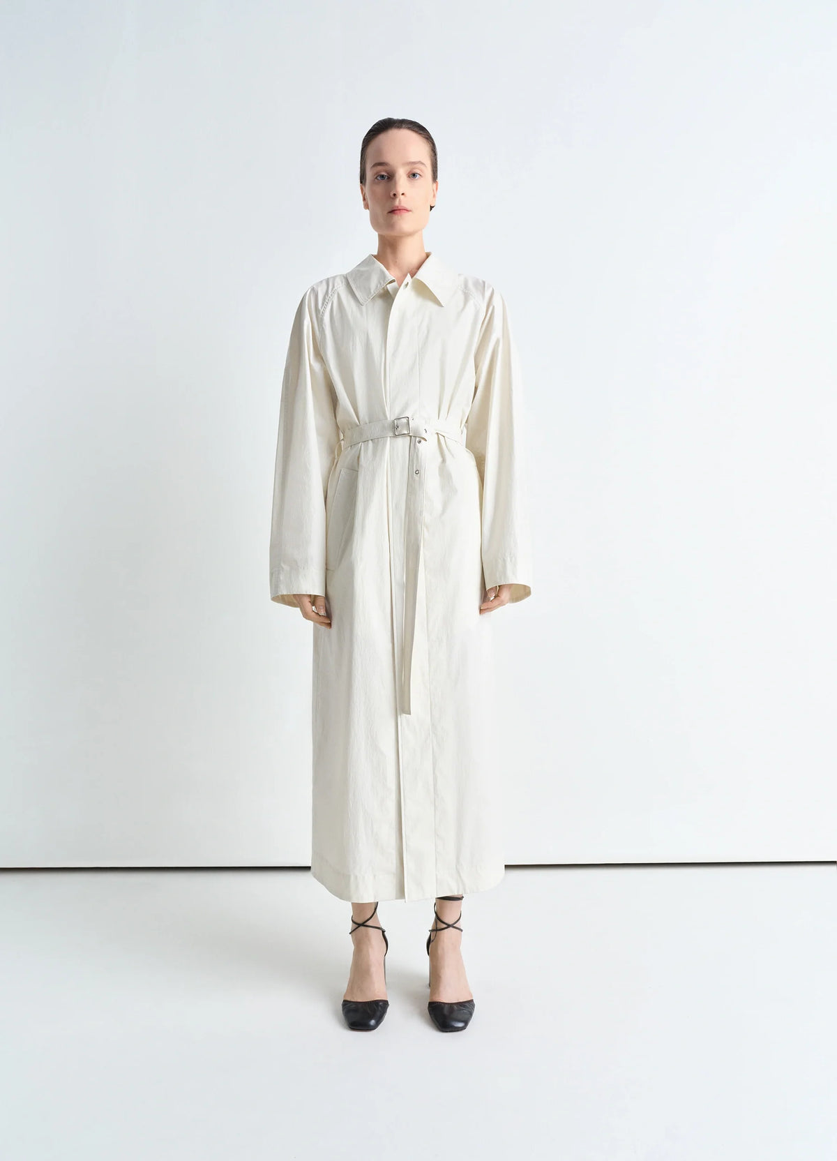 Lemaire Light Belted Coat in Light Coated Cotton, model shot, Front view Long belted cut