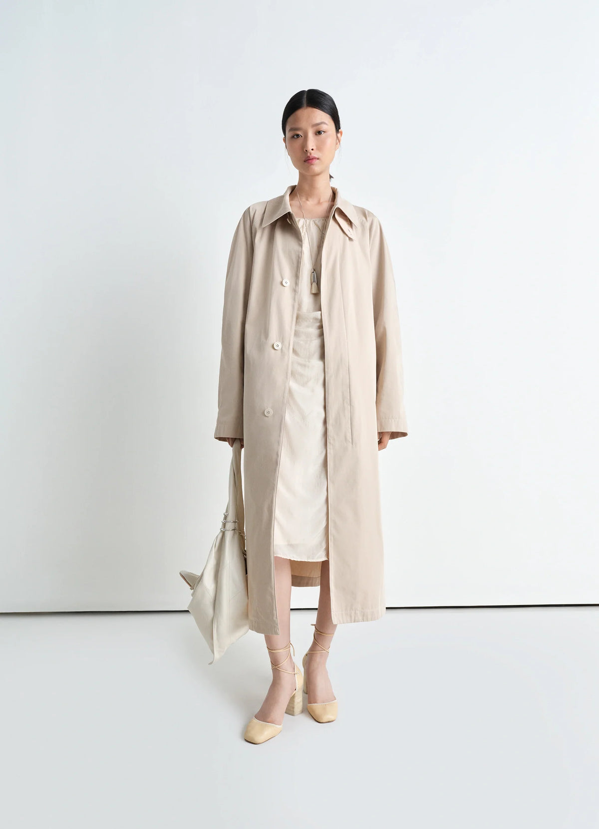 Lemaire Overcoat in Compact Cotton Twill, model shot, front view A shape generous sleeves