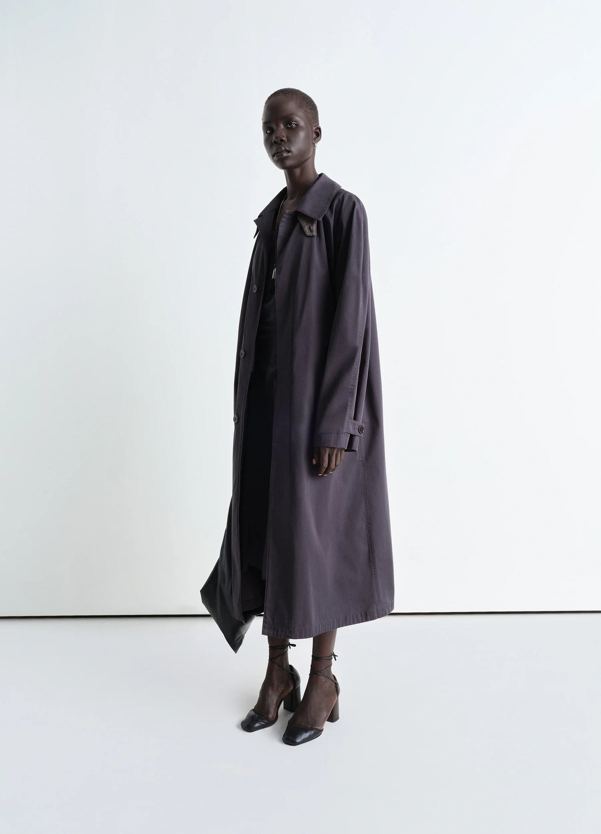 Lemaire Overcoat in Compact Cotton Twill, model shot, Side view A shape, generous sleeves