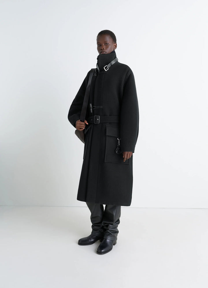 Lemaire Duffle Coat in Double-faced wool black, model shot, front three-quarter view shiny piping and belted