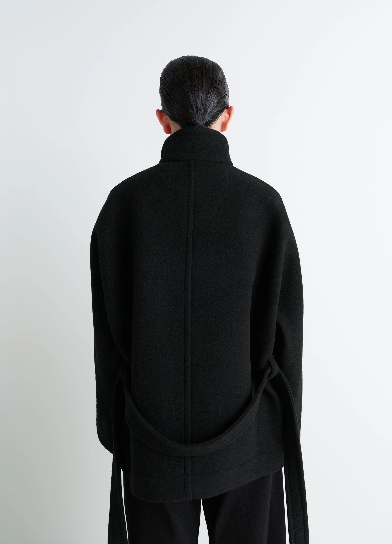 Lemaire short duffle coat in black double-faced wool, model shot, back view straight back seam