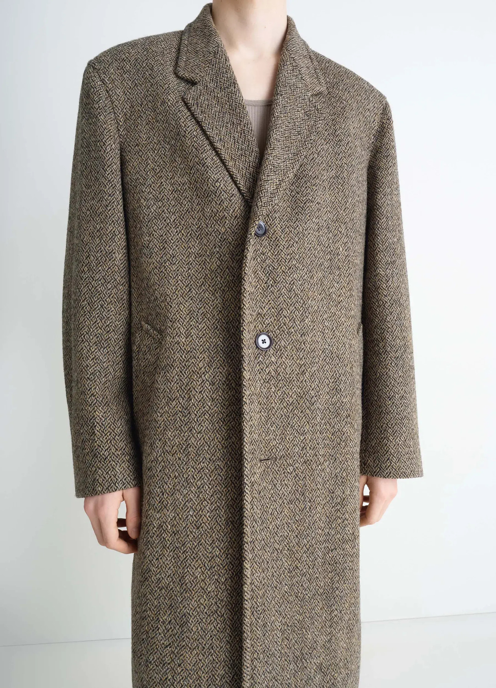 Chesterfield coat in herringbone harris tweed, model shot, close-up upper body buttoned closure detail