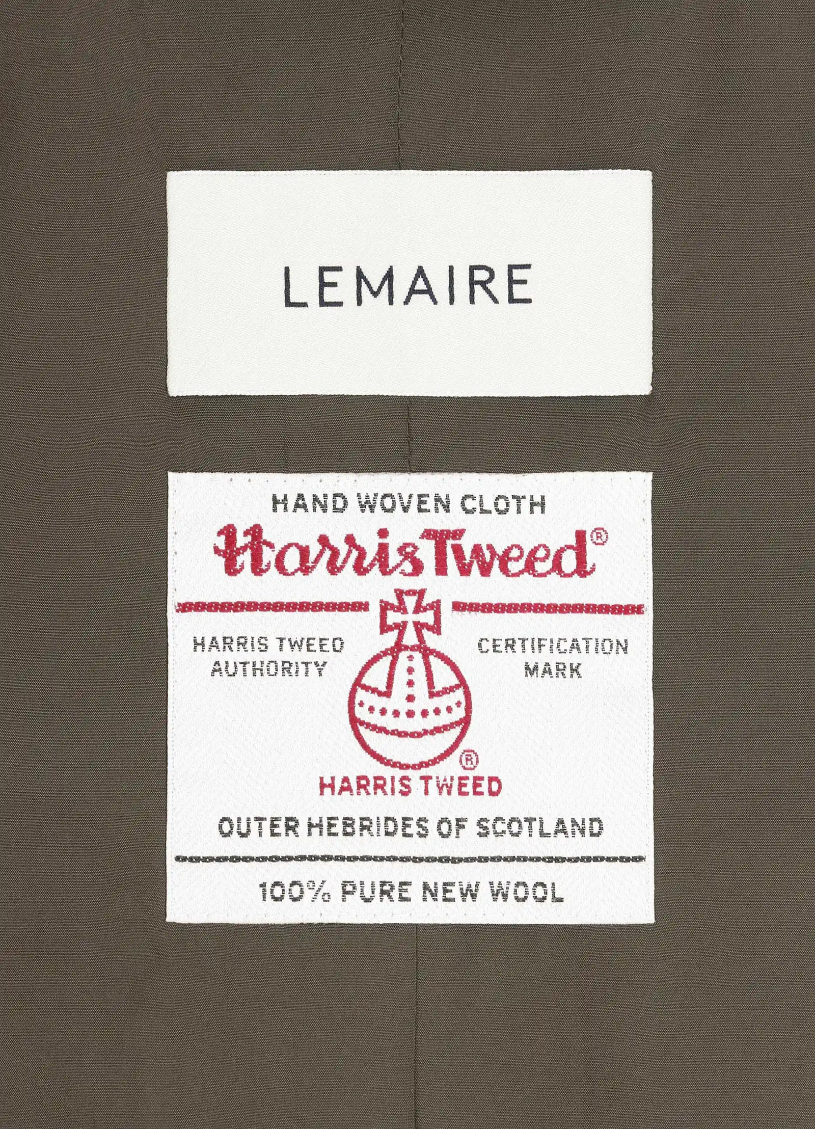 Chesterfield coat in herringbone harris tweed, fabric label close-up woven certification label
