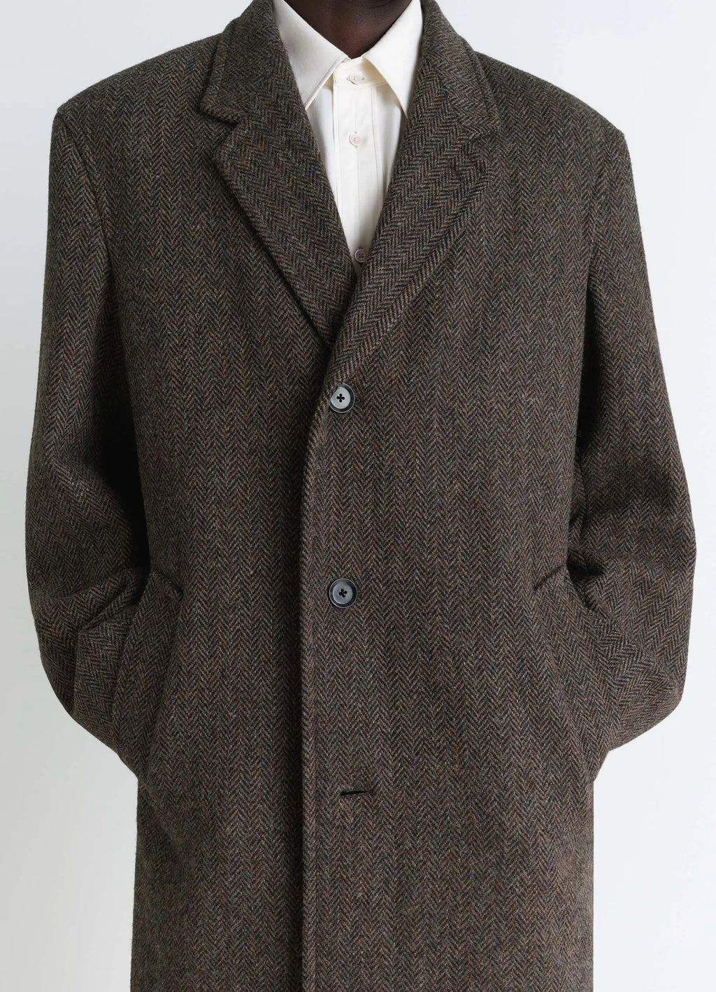 Chesterfield Coat in Harris Tweed Herringbone, model shot, close-up view notched lapel detail