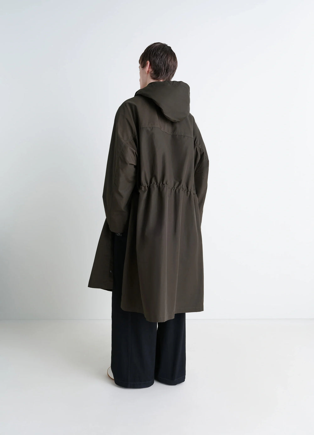 Lemaire Utility Raincoat in Khaki Linen Cotton Blend, model shot, back view cinched waist, relaxed fit