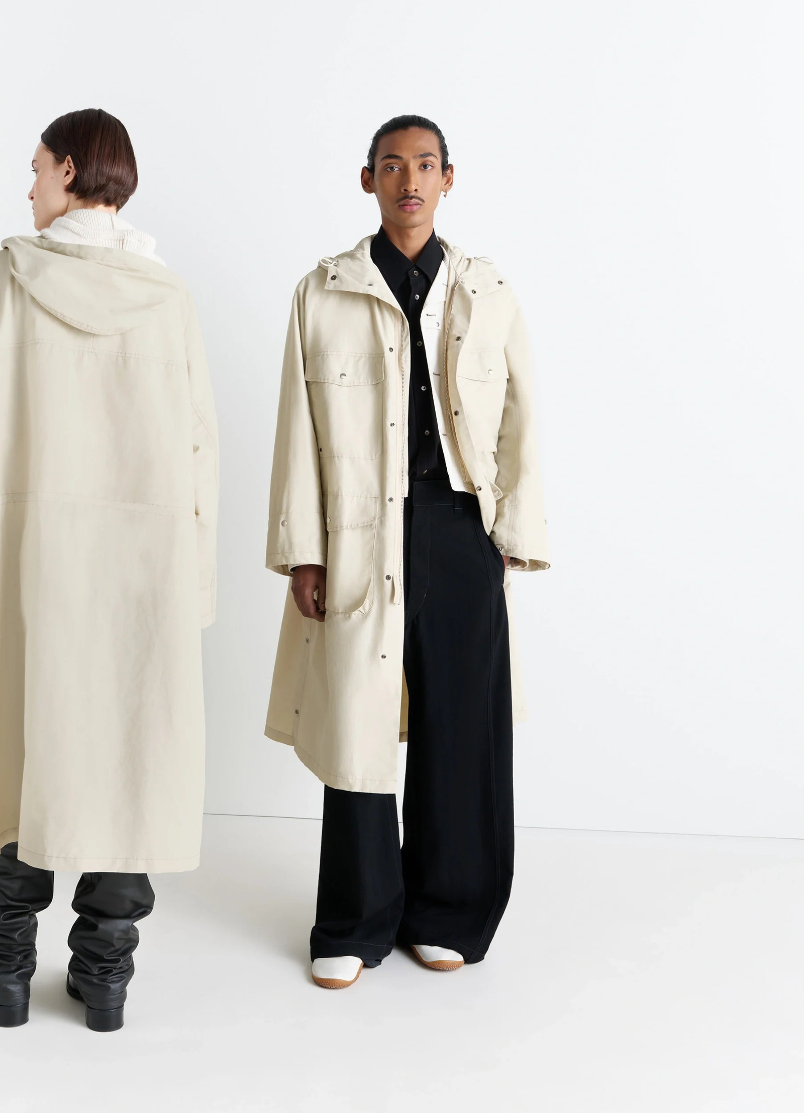 Lemaire utility raincoat in beige linen cotton blend, model shot, front and back view unisex, protective flaps