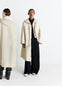 Lemaire Utility Raincoat in Beige Linen Cotton Blend, model shot, Front and back view Unisex, protective flaps