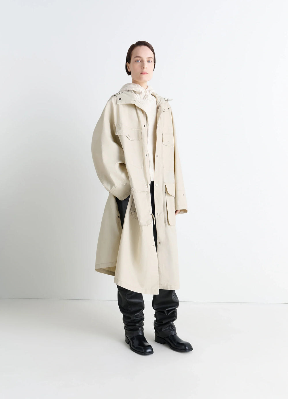 Lemaire Utility Raincoat in Beige Linen Cotton Blend, model shot, three-quarter view oversized fit, hooded