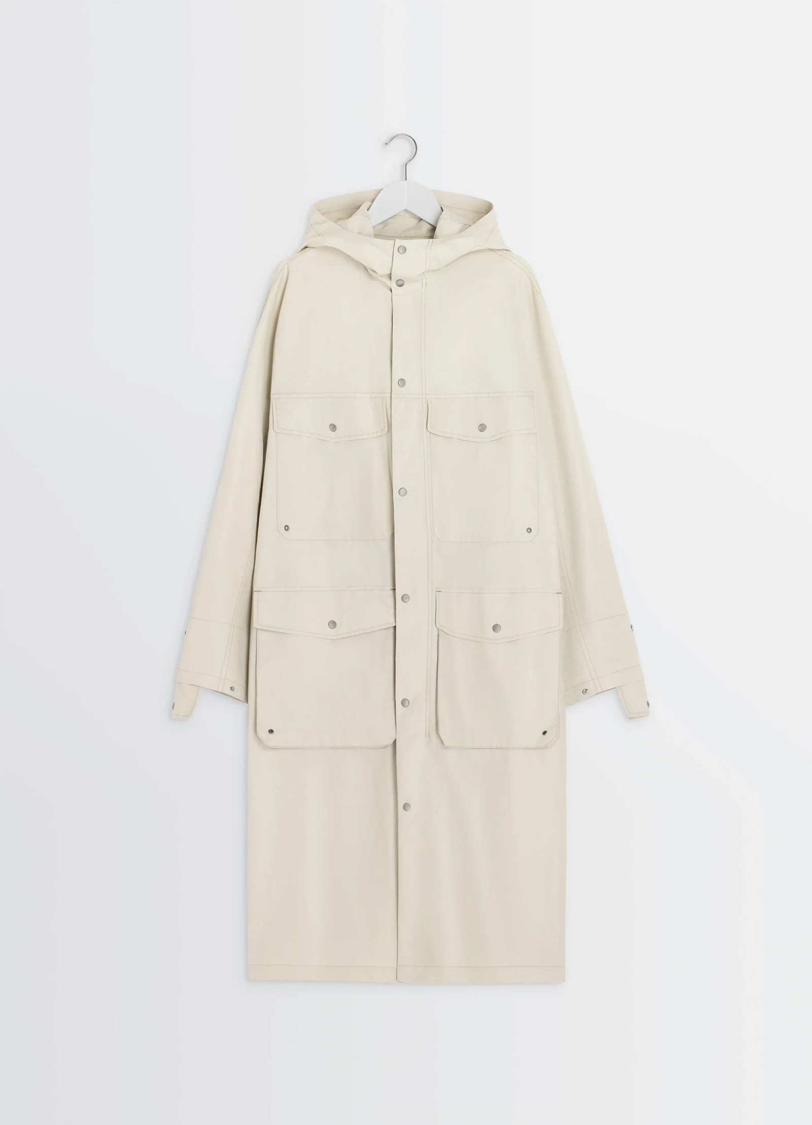 Lemaire utility raincoat in beige linen cotton blend, product shot, hanger front detail snap button utility pockets