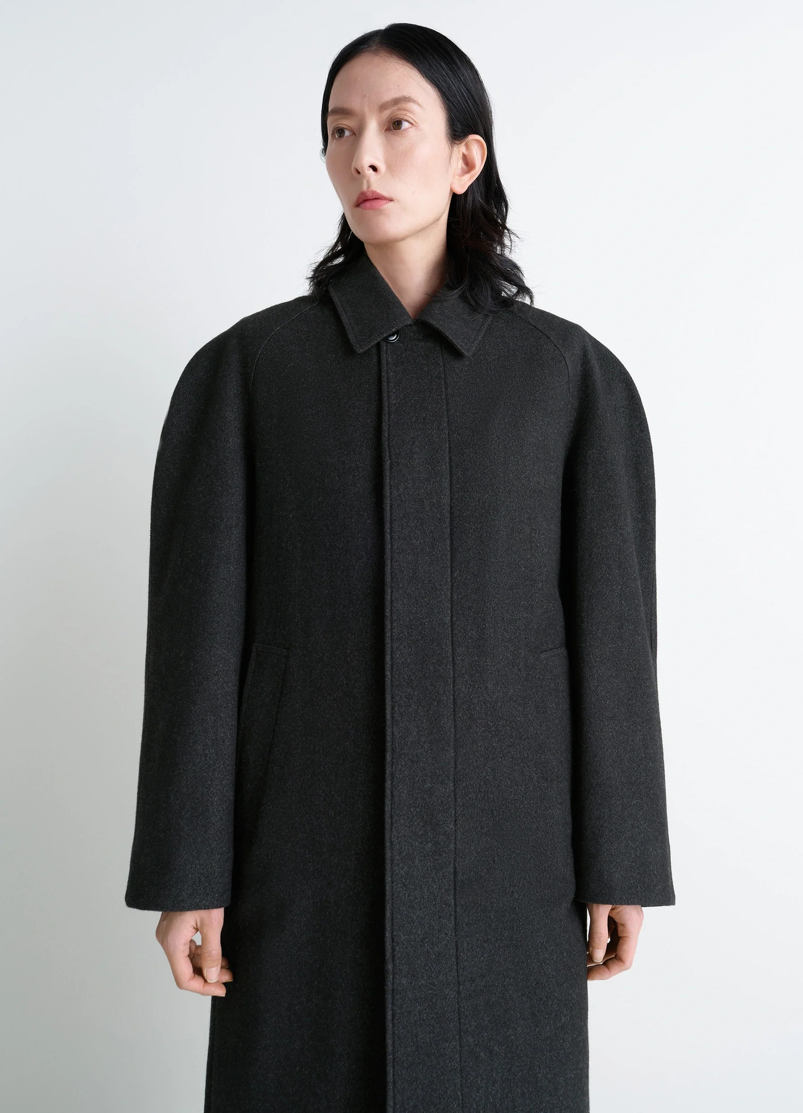 Lemaire raglan sleeve coat in rws wool cotton twill, model shot, three-quarter view puffed sleeves, structured cut