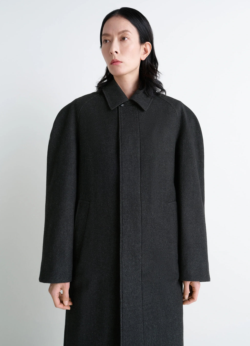 Lemaire Raglan Sleeve Coat in RWS wool cotton twill, model shot, three-quarter view puffed sleeves, structured cut