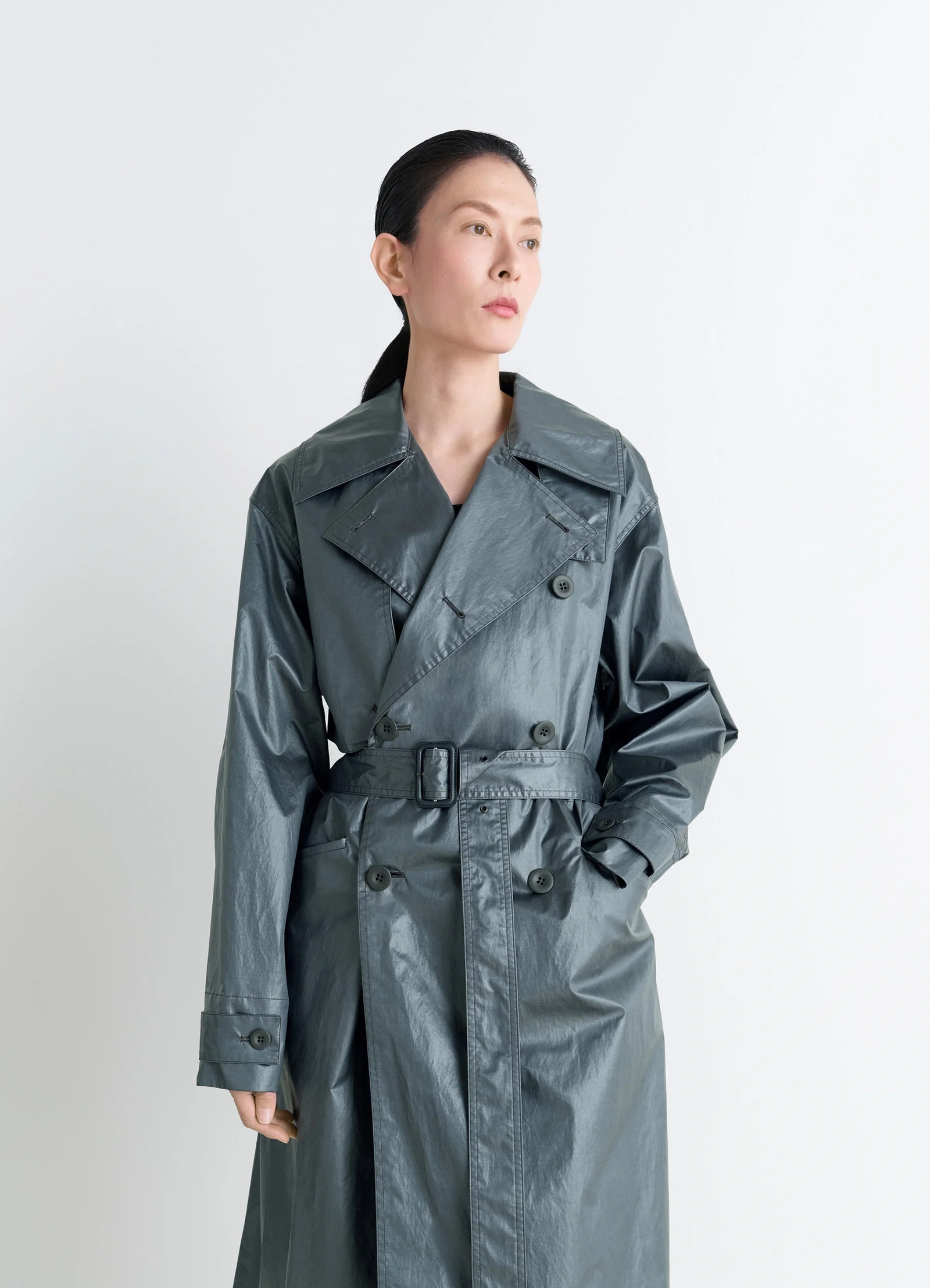 Oversized trench coat in metallic coated cotton, model shot, three-quarter view large lapels