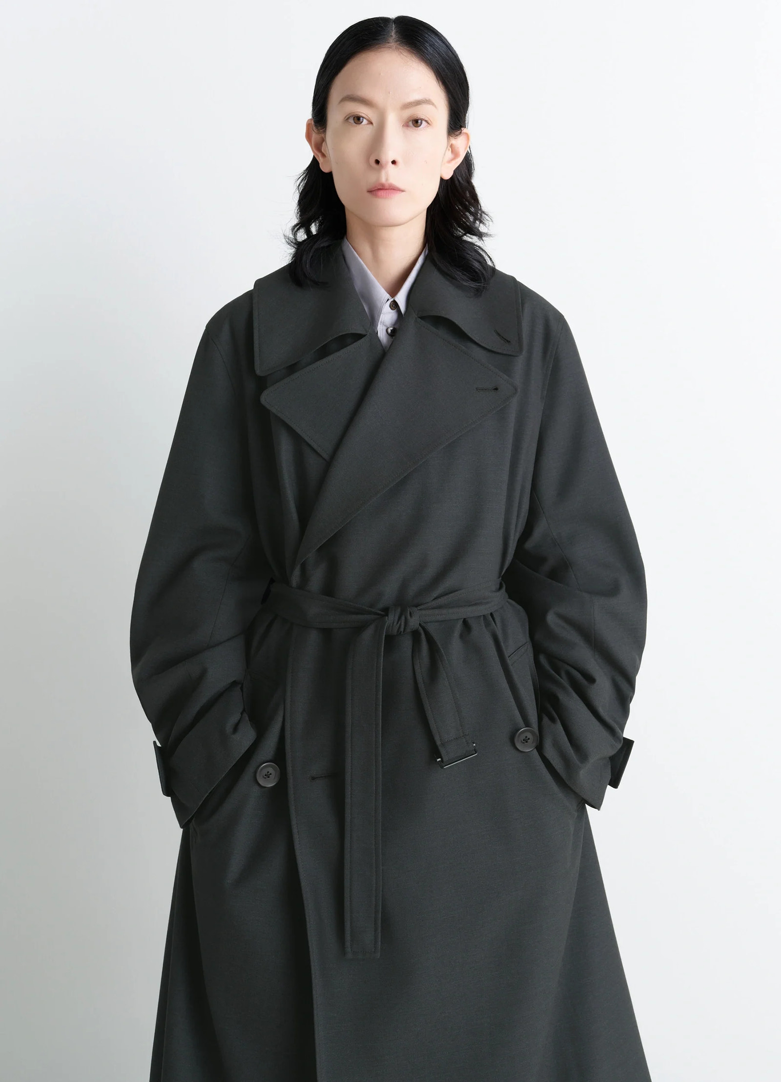 Lemaire trench coat in tropical wool-blend, model shot, waist-up portrait view belted waist detail
