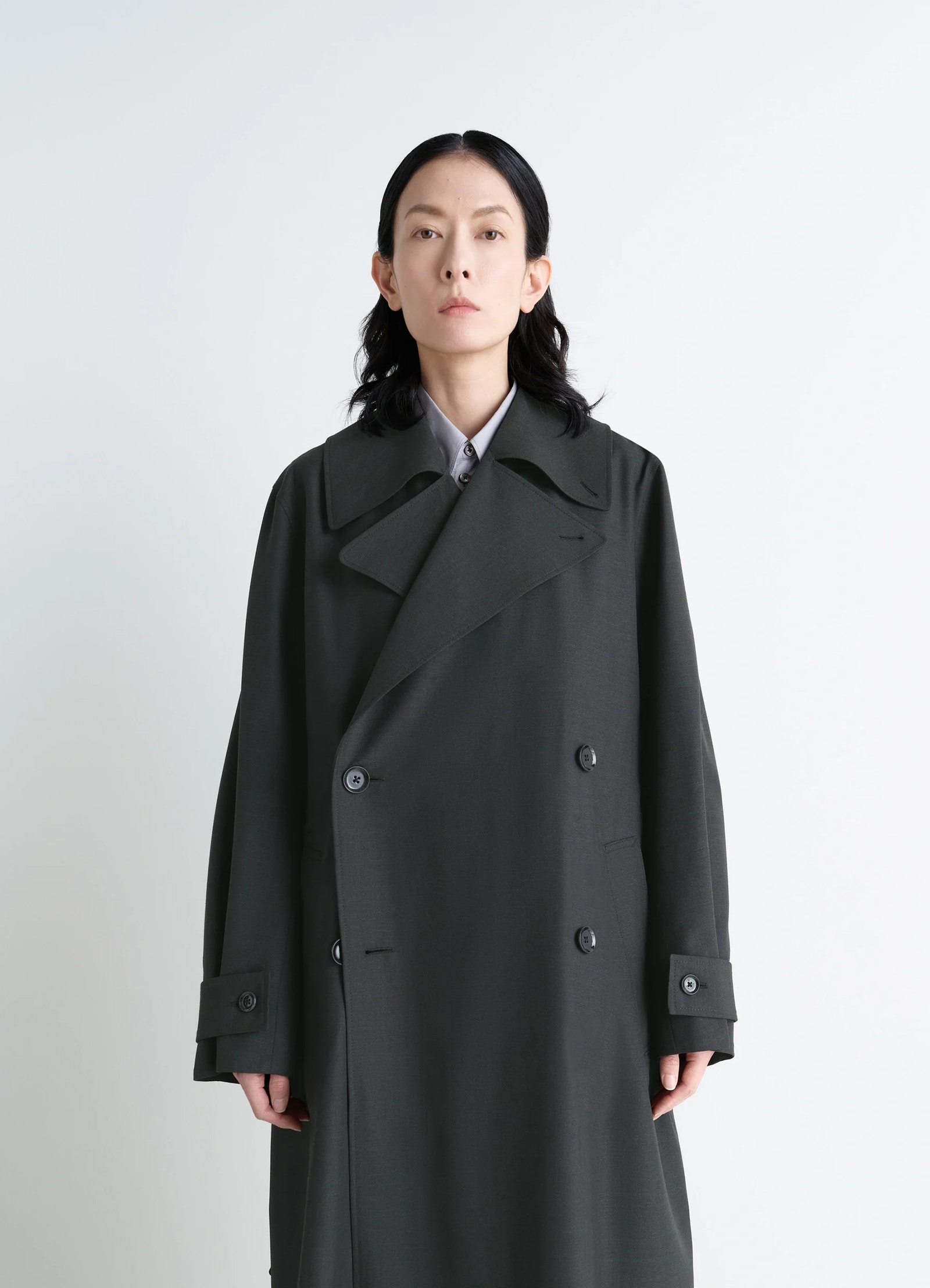 Lemaire trench coat in tropical wool-blend, model shot, close-up front view dropped shoulders