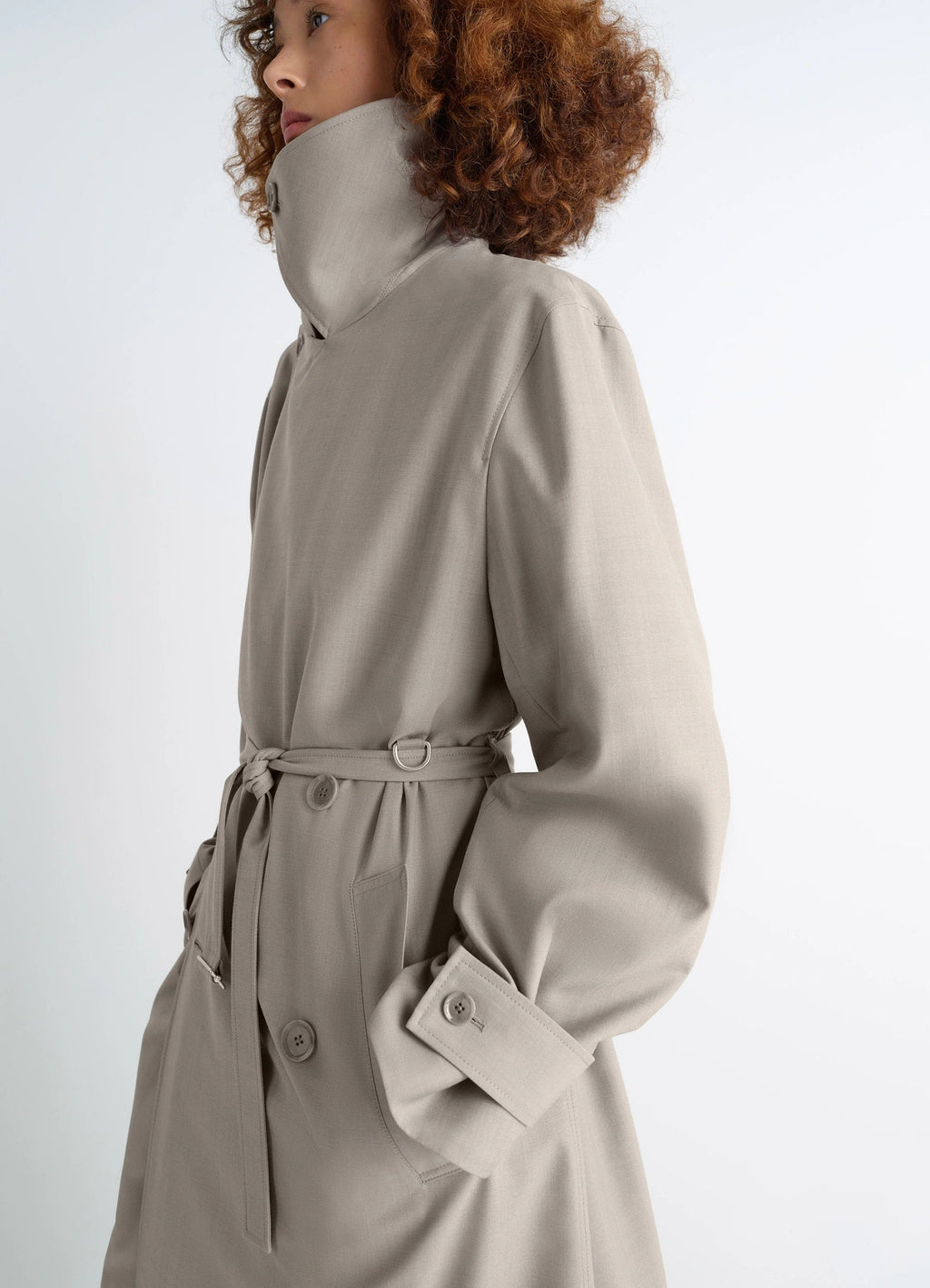 Lemaire Trench Coat in Tropical Wool-Blend Mottled, model shot, 3/4 view high collar and belt tie