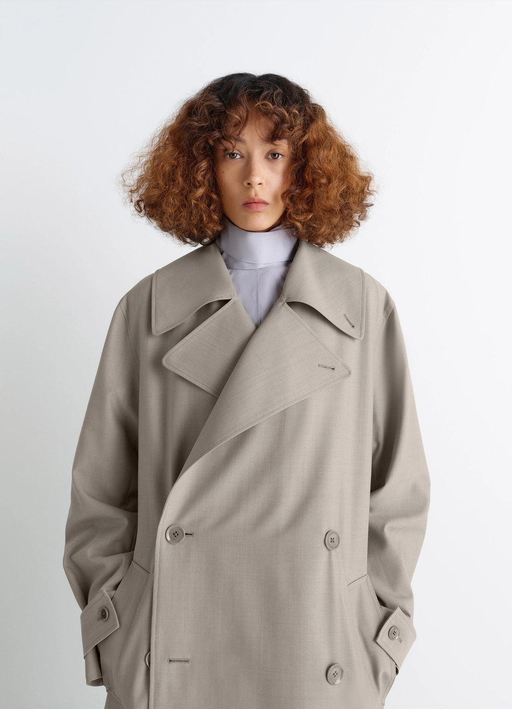 Lemaire Trench Coat in Tropical Wool-Blend Mottled, model shot, close-up view large lapels, double-breasted